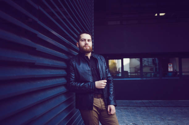 istock Cool man in a black leather jacket 1187554141
