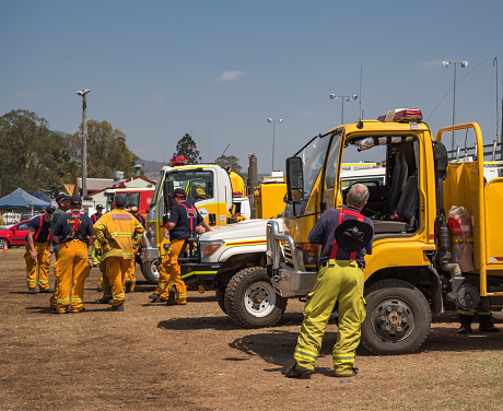 BOONAH, QUEENSLAND, AUSTRALIA - NOVEMBER 14. Firefighters  briefing at Boonah showgrounds before heading to Spicers Gap, Cunningham gap road, Moogerah area to fight bushfires. Firefighters from Tasmania and other states have arrived to help local crews.