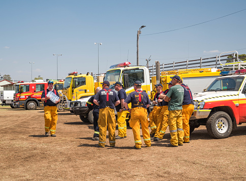 BOONAH, QUEENSLAND, AUSTRALIA - NOVEMBER 14. Firefighters  briefing at Boonah showgrounds before heading to Spicers Gap, Cunningham gap road, Moogerah area to fight bushfires. Firefighters from Tasmania and other states have arrived to help local crews.