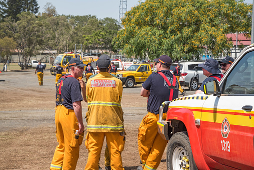 BOONAH, QUEENSLAND, AUSTRALIA - NOVEMBER 14. Firefighters  briefing at Boonah showgrounds before heading to Spicers Gap, Cunningham gap road, Moogerah area to fight bushfires. Firefighters from Tasmania and other states have arrived to help local crews.