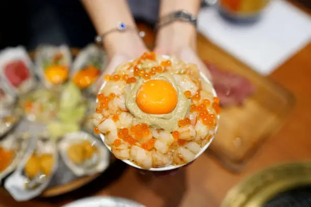 Photo of Mini donburi bowl - Japanese rice bowl topped with sweet shrimp, kani miso crab, salmon roe and topping egg yolk.