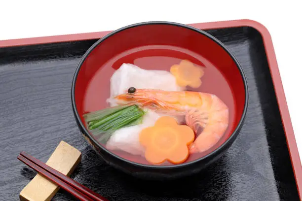 Japanese food, Zoni soup of mochi and ebi on black wooden tray