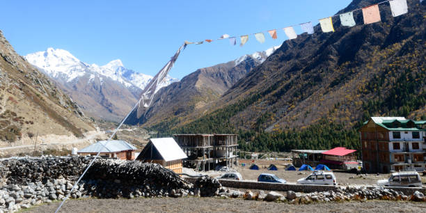 Scenic view of Chitkul india India’s last village. Whole terrain is surrounded by Himalayan Kailash mountain range, apple orchards, wooden houses, army ITBP barracks and Ranikanda meadows. Chitkul india May 2019 - Scenic view of India’s last village. Whole terrain is surrounded by Himalayan Kailash mountain range, apple orchards, wooden houses, army ITBP barracks and Ranikanda meadows. Tibetan Border stock pictures, royalty-free photos & images
