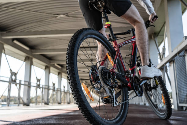 istock Young man biking in city 1187559367