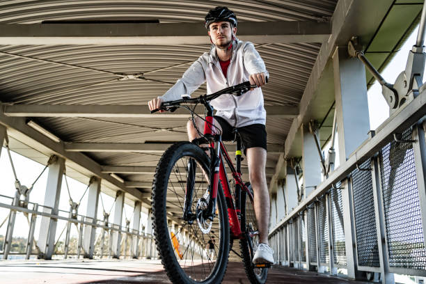 istock Young man biking in city 1187559422