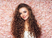 Beautiful girl with long and curly hairs