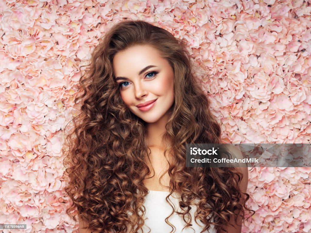 Beautiful girl with long and curly hairs Wedding Stock Photo