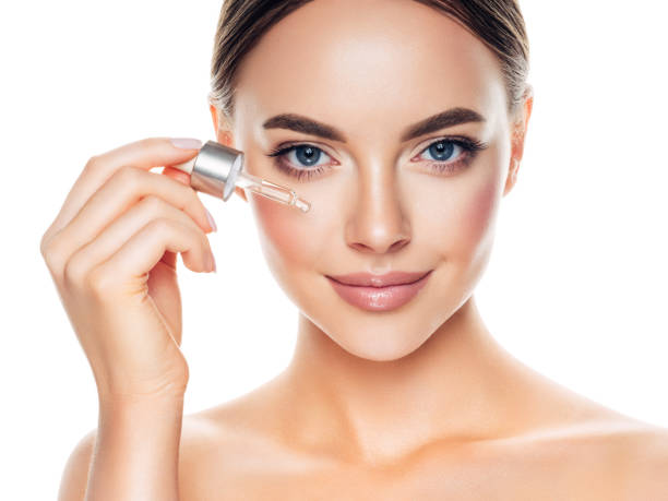 Beautiful girl getting skin anti aging treatment Beautiful girl getting skin anti aging treatment essential oil photos stock pictures, royalty-free photos & images