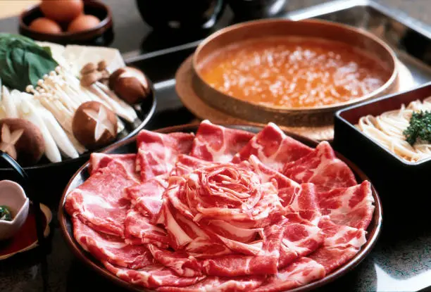 Shabu shabu hot pot of black pork, a famous product of Kagoshima Prefecture. Boil the slices into a pot soup for a few seconds and eat them.