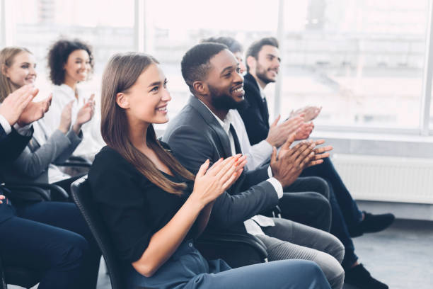 istock Group of business people applauding speaker after presentation 1187570049