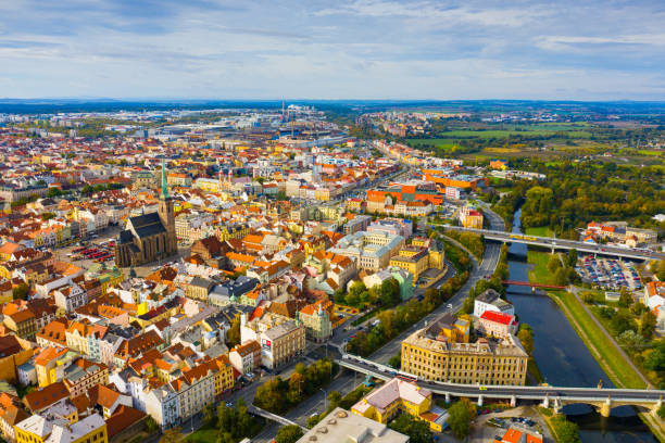 Aerial view of Plzen PLZEN, CZECH REPUBLIC - OCTOBER 11, 2019: Aerial view of historical centre of Plzen in autumn day overlooking Gothic spire of medieval Cathedral pilsen stock pictures, royalty-free photos & images