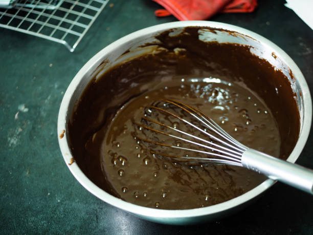 istock Chocolate butter cream in big bowl, processing cupcakes. 1187574681