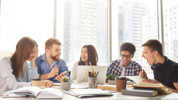 istock Excited college friends preparing for lectures in library 1187574764
