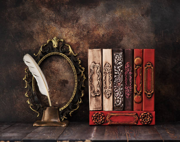 istock Vintage books on a shelf, a bronze frame and old inkwell 1187575539