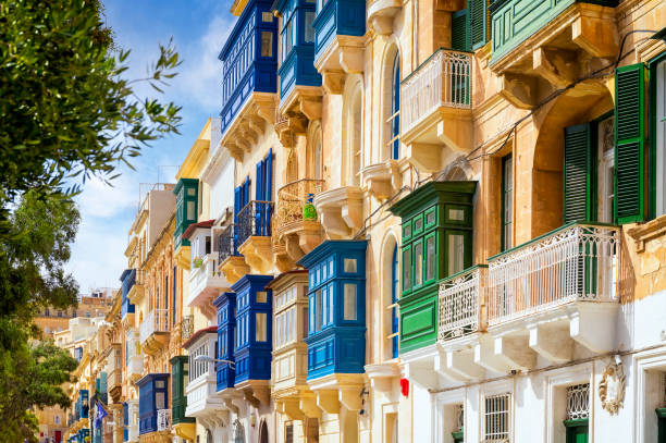 Traditional closed wooden balconies on the streets of Valletta, Malta, Europe stock photo