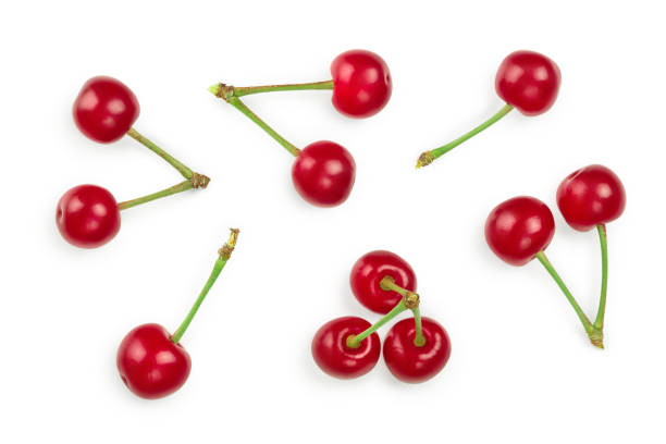 istock Some cherries with leaf closeup isolated on white background. Top view. Flat lay. 1187575846