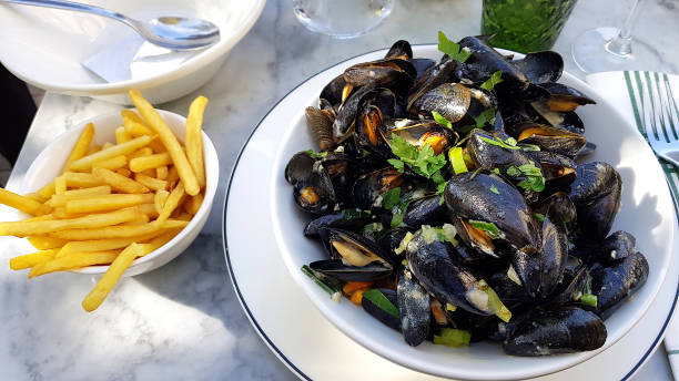 istock Big typical Mediterranean mussels plate with fries 1187575913