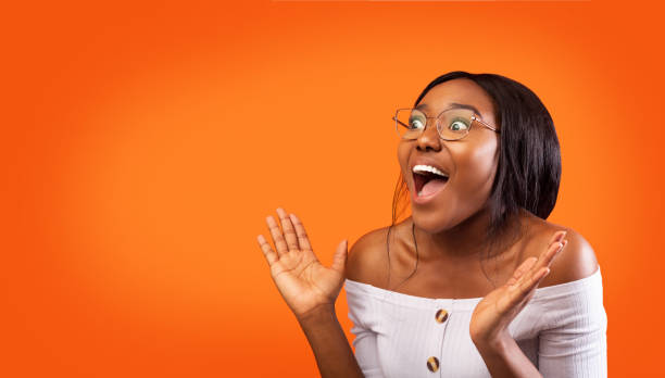 istock Excited Afro Girl Shouting Standing Over Orange Studio Background, Panorama 1187576033