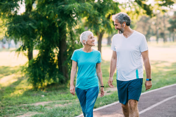 istock Mature couple jogging at the park 1187576089