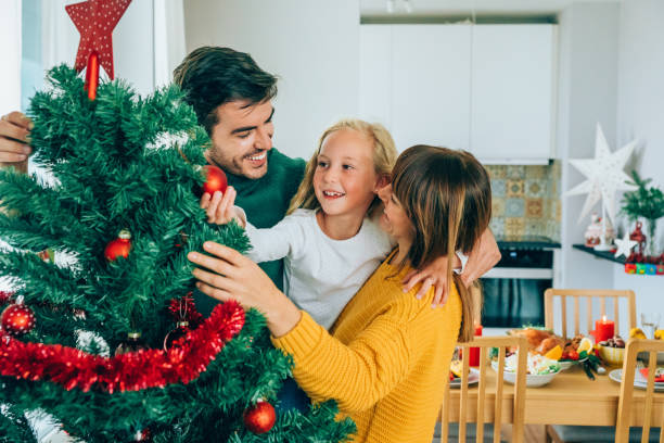 istock Family celebrating Christmas at home 1187576113