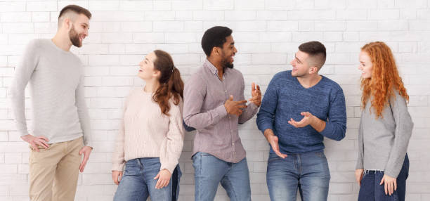 istock Cheerful friends talking, having break at college 1187576411