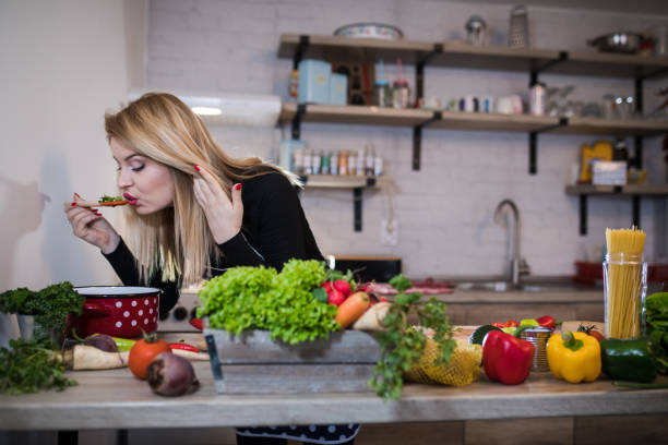istock Young Woman Cooking in the kitchen. 1187577507