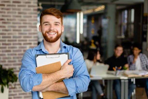 istock Student lifestyle. Happy student posing in library 1187579433