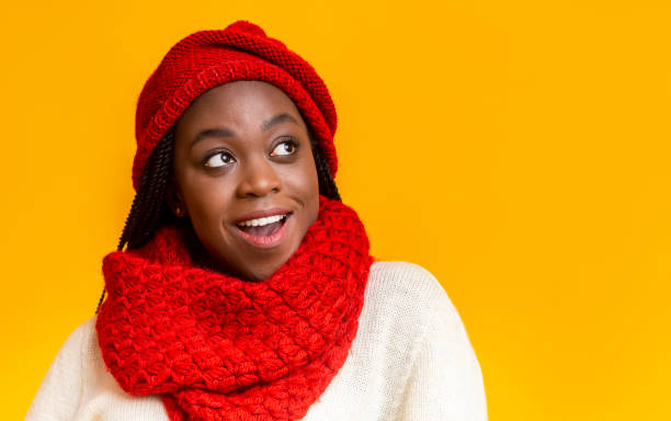 istock Excited smiling winter girl looking at empty space 1187580685