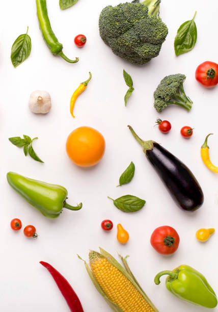 istock Variety of flying vegetables over white background 1187581820
