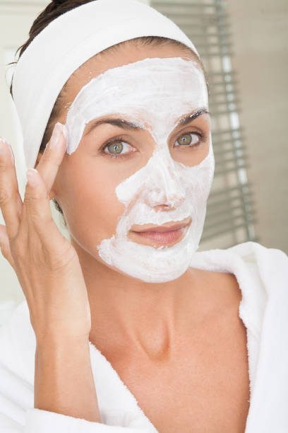 istock woman applying a beauty mask 1187582190