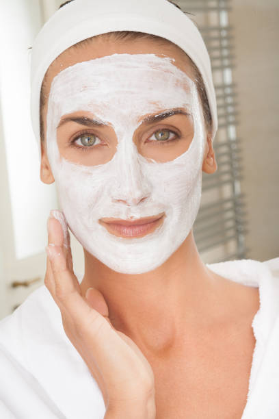 istock woman applying a beauty mask 1187582222