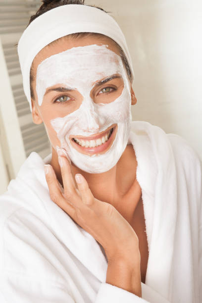istock woman applying a beauty mask 1187582383