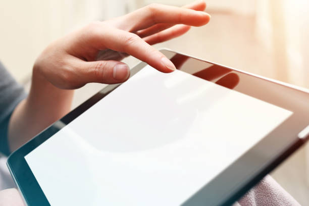 istock Close-up of Woman's Hands Using Digital Tablet 1187583375