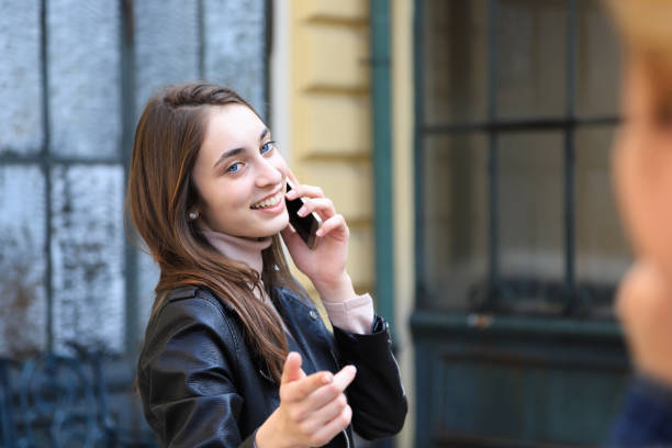 istock Young woman talking on the phone 1187583775