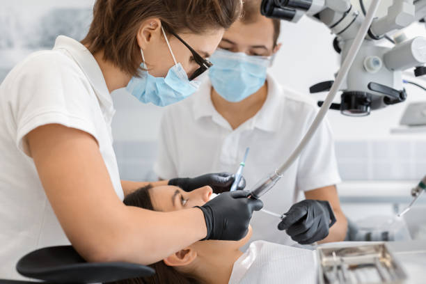 istock Young woman client attending modern dentist clinic 1187583859