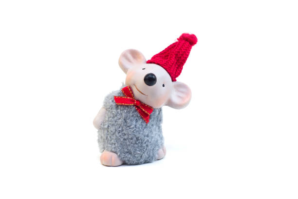 Toy funny, gray mouse, rat in a red Christmas hat on a white background, isolate