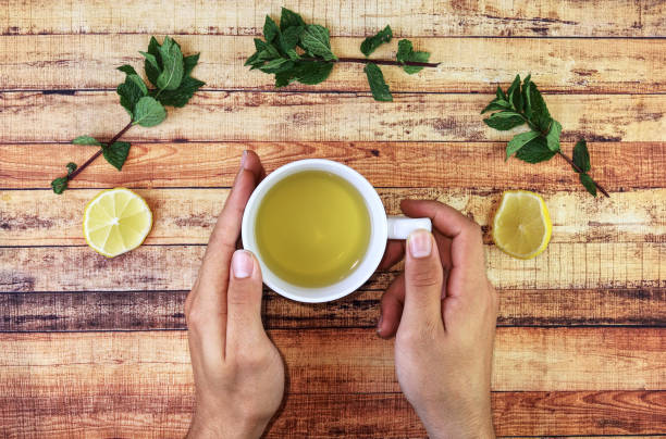 istock Illness in full swing. Is neccessary prevent further progress. Needs hot salvia tea with admixture mint leaves, honey and lemon. Modern apothecary. Alternative medicine 1187588488