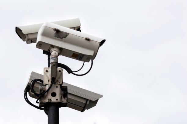 istock Close Up of a Security CCTV Surveillance Cameras on a lamp post. 1187588598