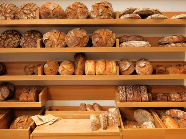 istock Modern bakery with different kinds of bread, cakes and buns 1187590345