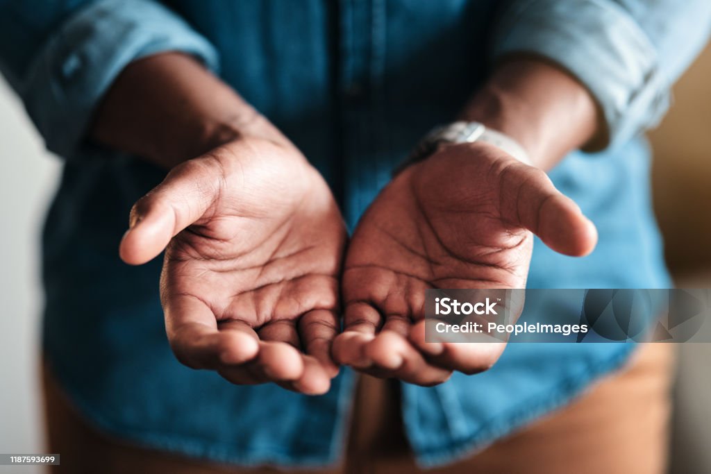 Place your trust in my hands Cropped shot of an unrecognizable businessman standing in his home office and holding out his hands in a pleading gesture Hand Stock Photo