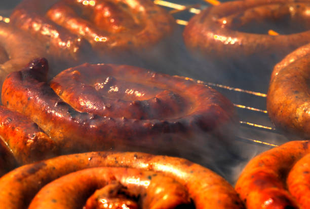 istock Grilling delicious sausages on barbecue 1187597990