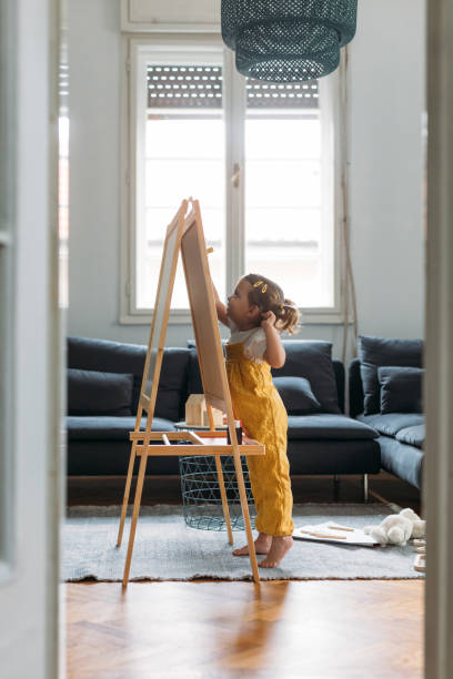 istock Four Years Old Girl Drawing on Board 1187599024