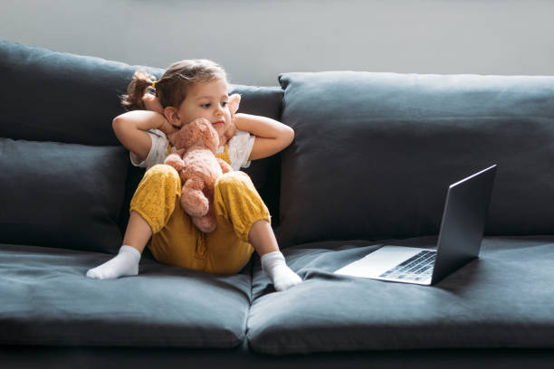 istock Little Girl Looking at Laptop 1187599039