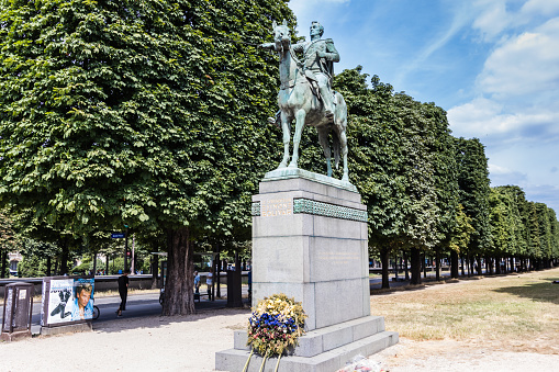The statue of Simon Bolivar, Le Librateur, sits at the edge of the River Seine near the Pont Alexandre III on the Cours la Reine, a public promenade in Paris. Simon sits high on his horse watching over the river.