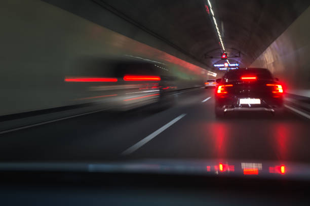 hectic morning traffic in a road tunnel at rush hour stock photo