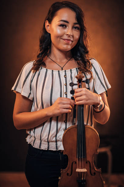 istock Cute lady violinist 1187600622