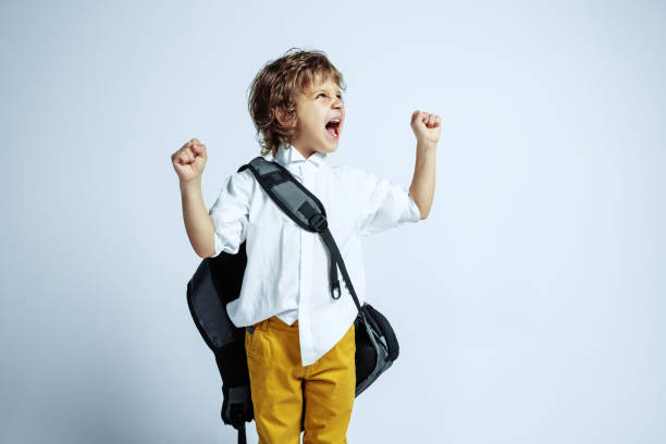 istock Pretty young boy in casual clothes on white studio background 1187606475