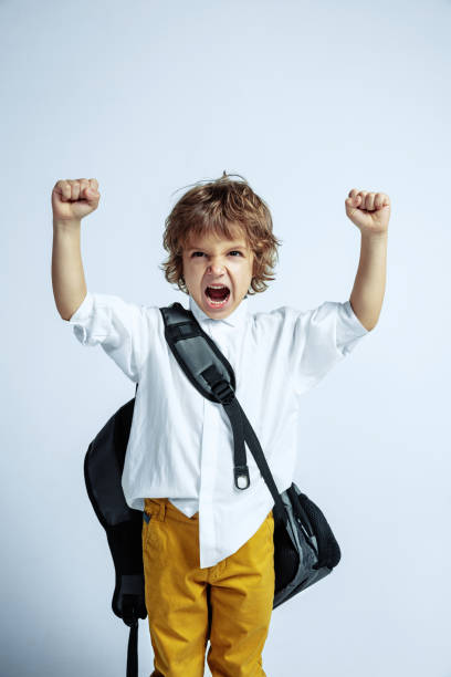 istock Pretty young boy in casual clothes on white studio background 1187606487