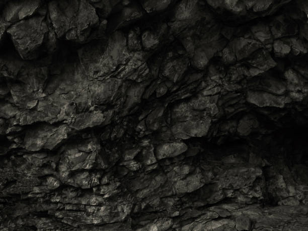 istock Black rock background. Dark stone texture. Black grunge background. Mountain close-up. 1187607209