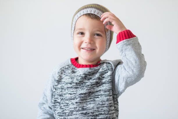 funny cute kid in knitted hat
